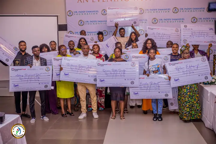 Grant recipients on stage with their cheques