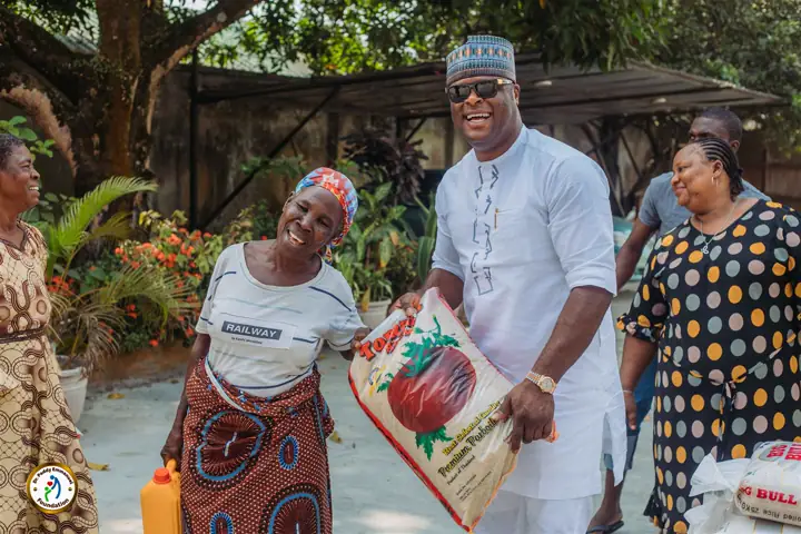 Dr Paddy Iyamu with a beneficiary at Gift of Love