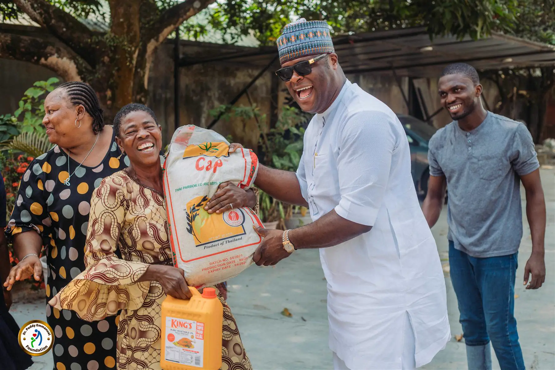Dr Paddy Iyamu laughing with women at a Foundation community outreach