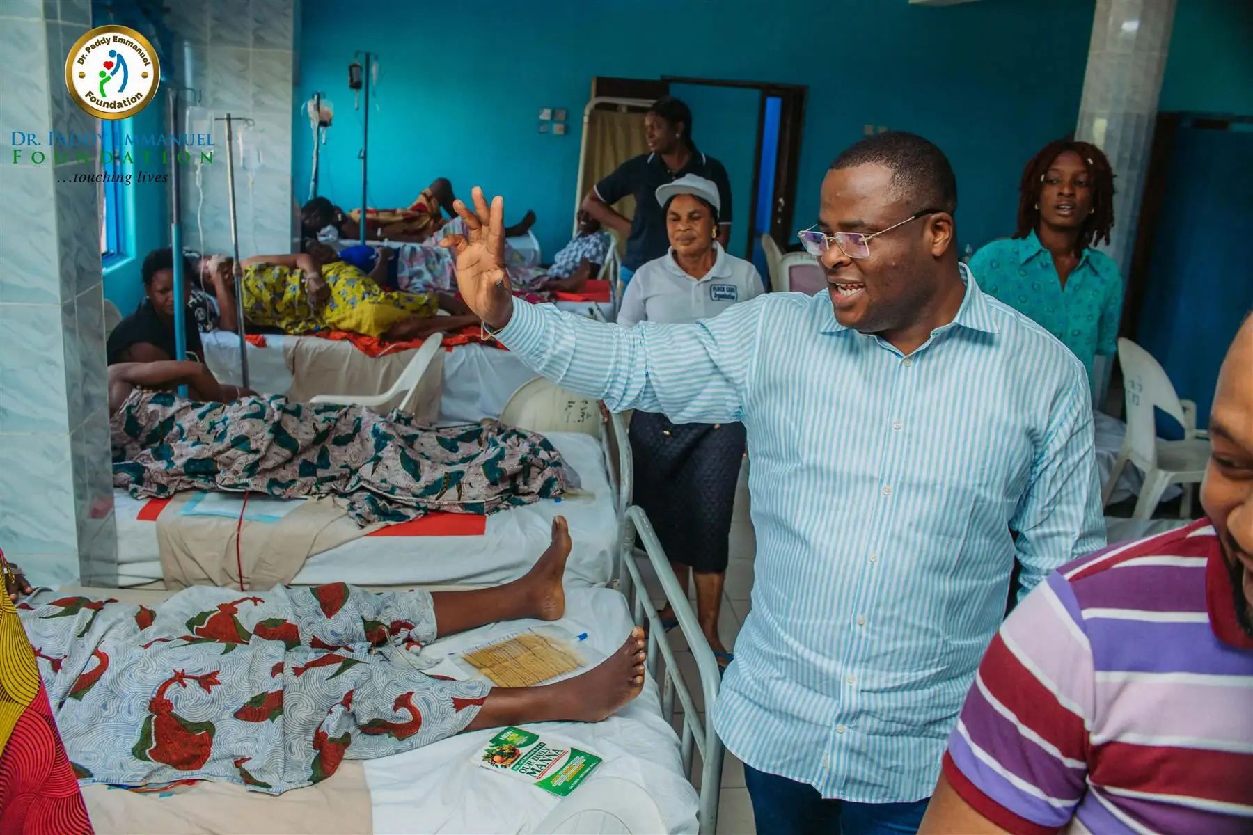 Dr Paddy Iyamu greeting patients in a ward during a Foundation surgical outreach