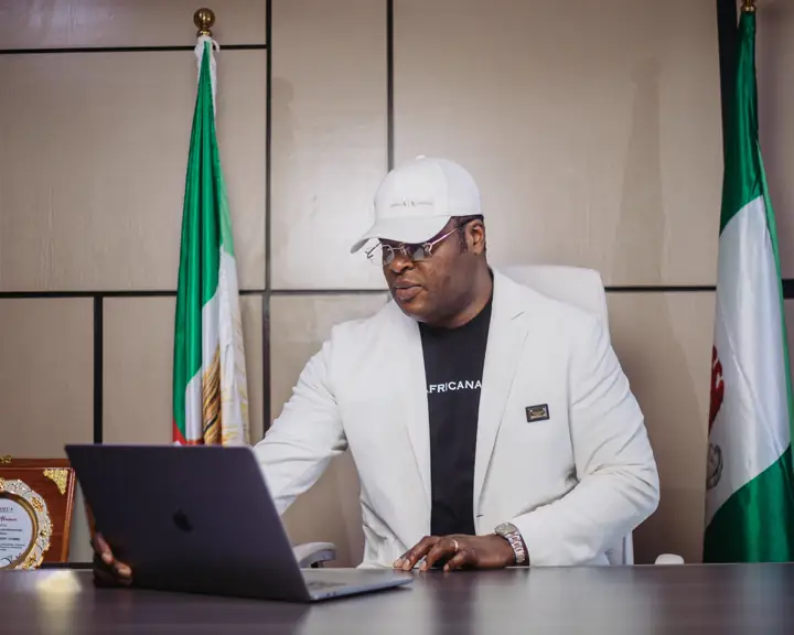Dr Paddy Iyamu at his desk in the commissioner's office